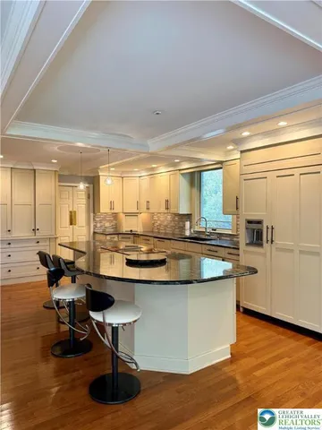 a bathroom with a sink a vanity and a mirror