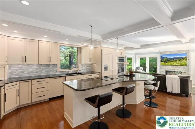 a bathroom with a glass door shower and a sink