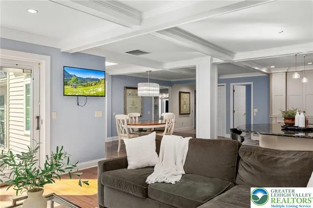 a bathroom with a granite countertop double vanity sink mirror and toilet