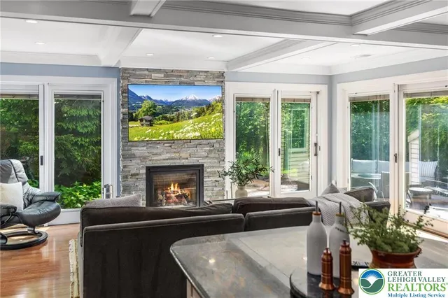 a living room with pool table and a flat screen tv