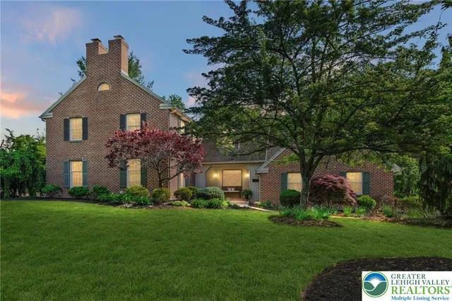 a view of a backyard with table and chairs