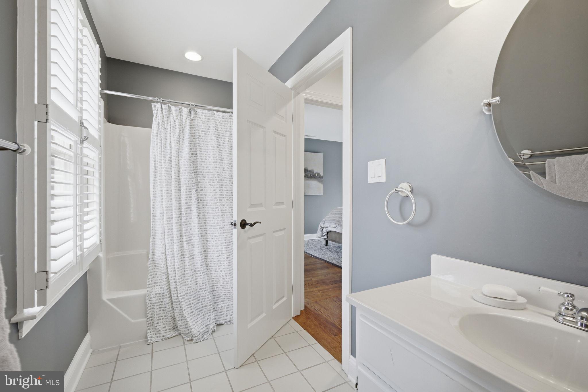 222 East Chestnut Street St. Michaels, MD 21663 - Photo 22 of 58 a bathroom with a sink a toilet and shower