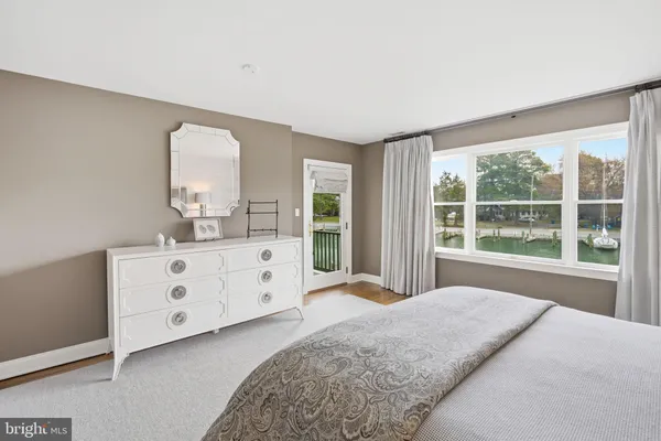 a spacious bedroom with a large bed and a window