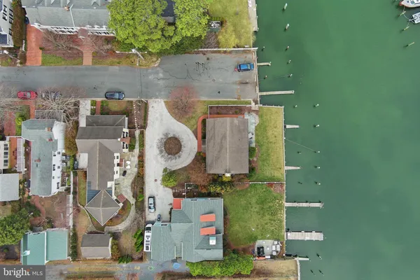 an aerial view of residential house with outdoor space and parking