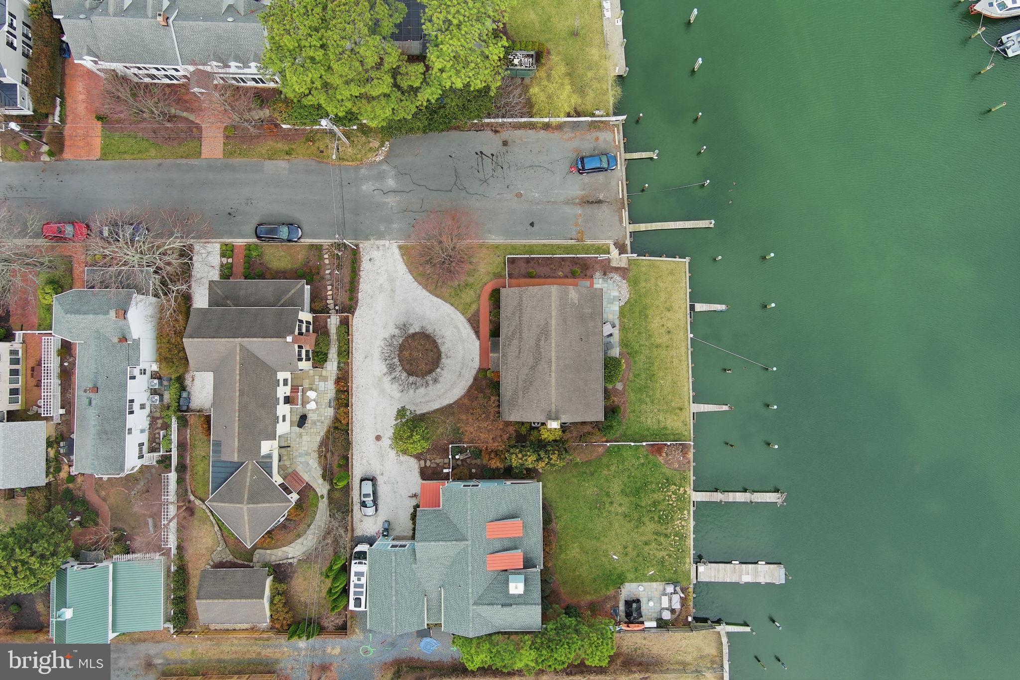 222 East Chestnut Street St. Michaels, MD 21663 - Photo 28 of 58 an aerial view of residential house with outdoor space and parking