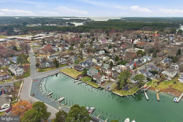 an aerial view of a house with a lake view