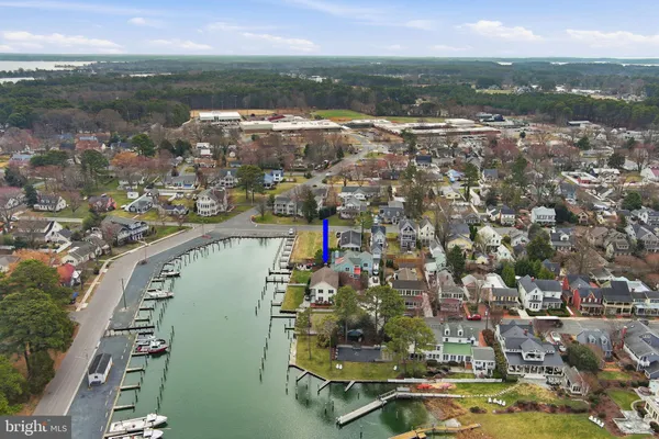 an aerial view of a house with a lake view