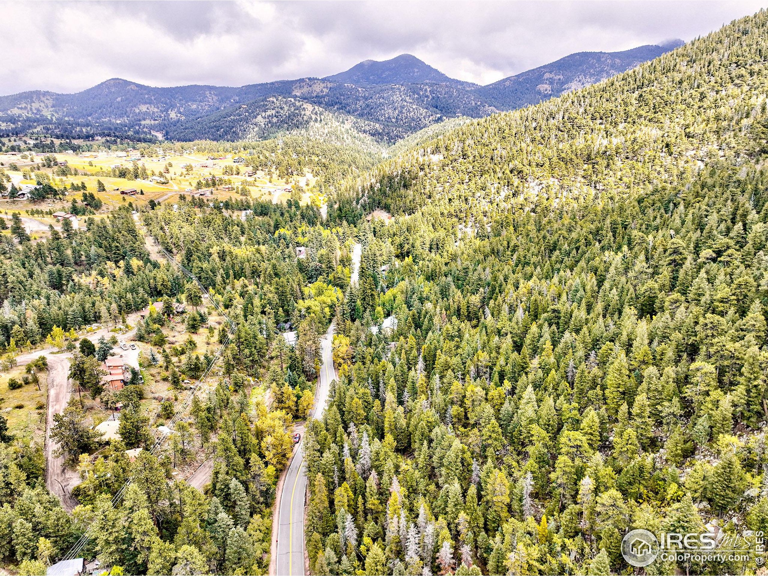 10862 Twin Spruce Road Golden, CO 80403 - Photo 12 of 15 a view of a mountain with an outdoor space