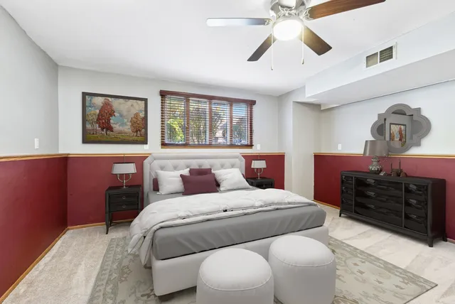 a bedroom with a bed and dresser