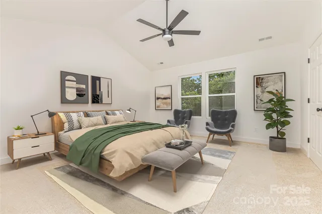 a bedroom with a bed and a table and chair