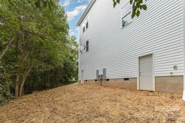 a view of a house with a yard and garage