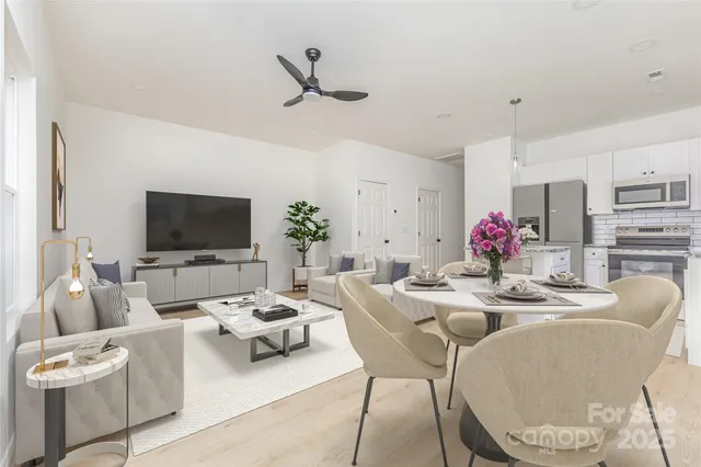 a living room with furniture and a flat screen tv