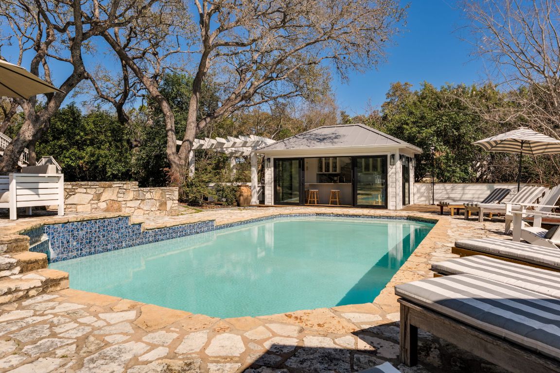 a view of a swimming pool with a patio