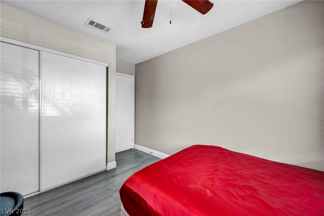 5882 Rio Tinto Way Las Vegas, NV 89110 - Photo 35 of 56 Well-appointed bedroom featuring sleek flooring and a space-saving sliding door closet.