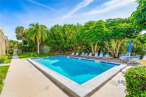 a view of a swimming pool with a patio