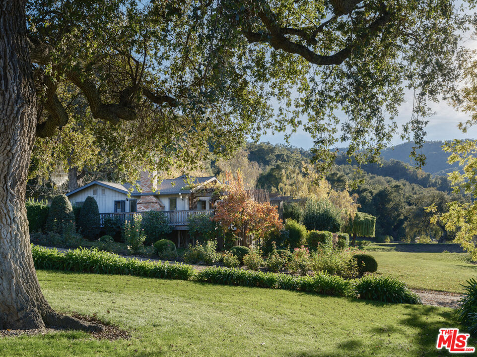 20300 Cachagua Road Carmel Valley, CA 93924 - Photo 5 of 37 a front view of house with garden