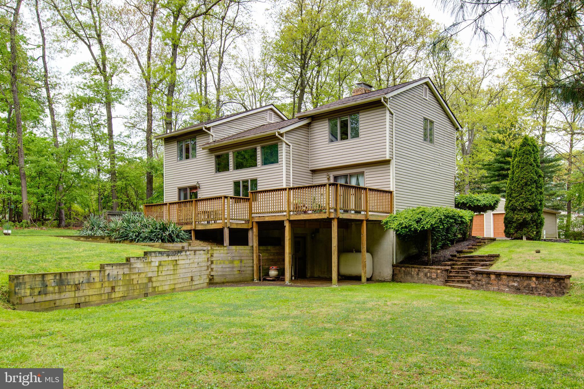 5519 Woodbine Road Sykesville, MD 21784 - Photo 57 of 69 a view of a house with a yard and sitting area