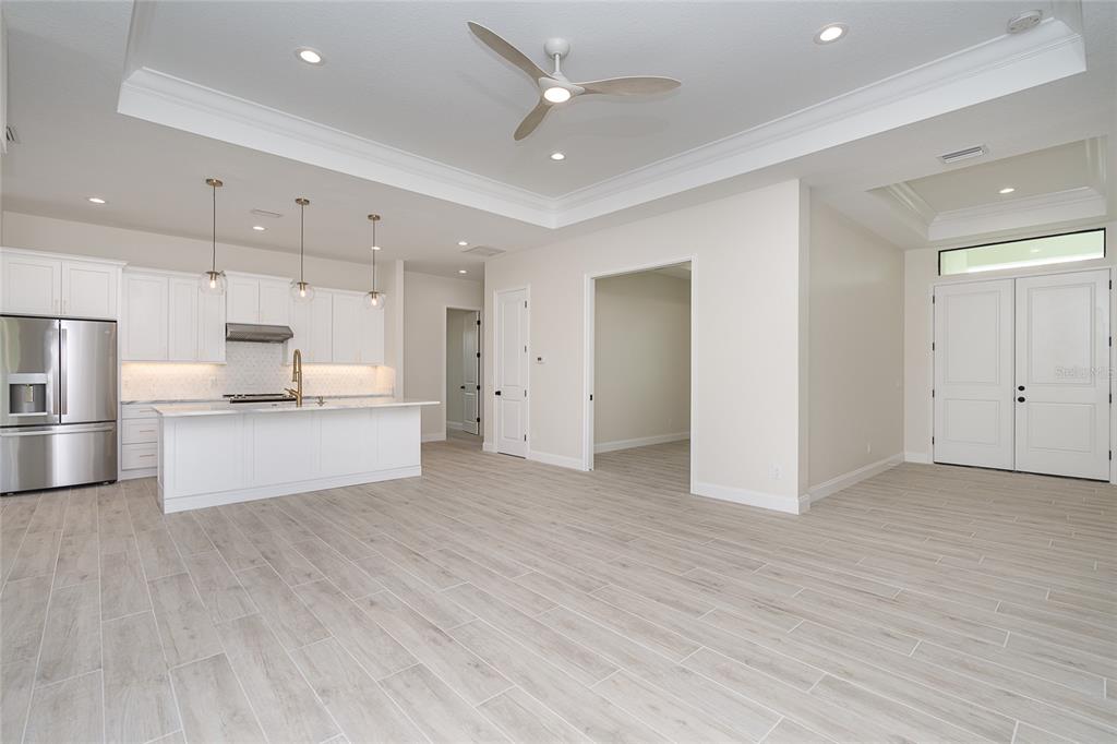 191 Tournament Road Rotonda West, FL 33947 - Photo 14 of 41 a view of kitchen with refrigerator stove microwave and cabinets
