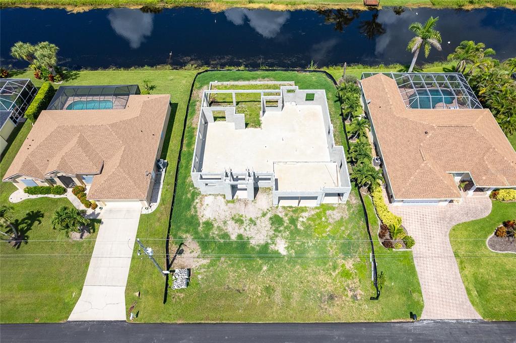 191 Tournament Road Rotonda West, FL 33947 - Photo 2 of 41 an aerial view of a house with a yard