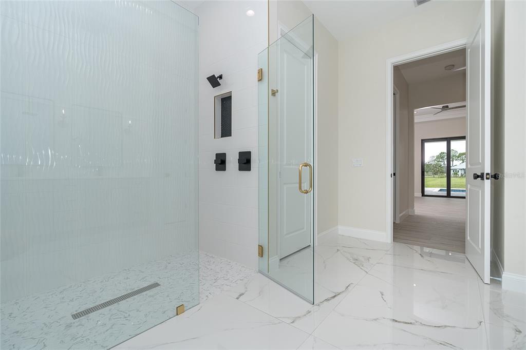 191 Tournament Road Rotonda West, FL 33947 - Photo 30 of 41 a bathroom with a shower and toilet