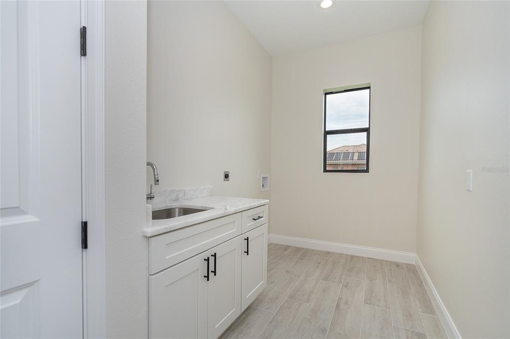 191 Tournament Road Rotonda West, FL 33947 - Photo 35 of 41 a view with cabinets