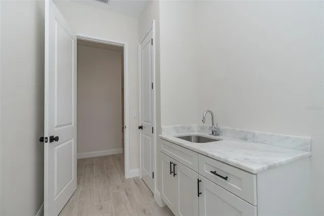 a view of a porch with a table and chairs