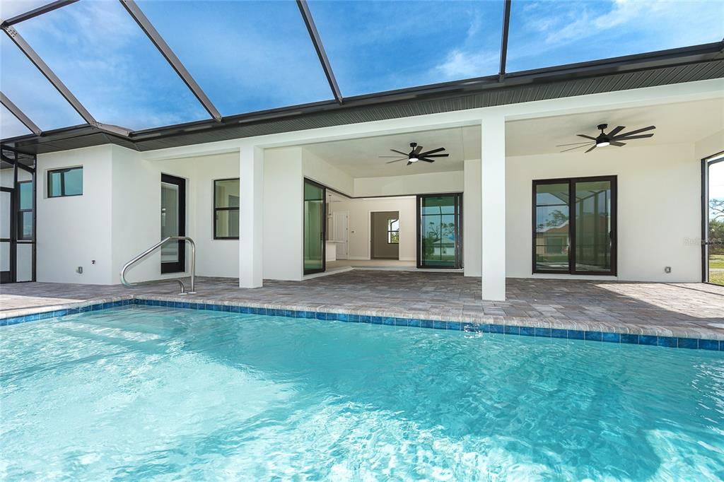 191 Tournament Road Rotonda West, FL 33947 - Photo 37 of 41 a view of a porch with a table and chairs