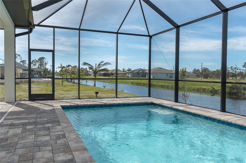 191 Tournament Road Rotonda West, FL 33947 - Photo 41 of 41 a view of back yard with porch and furniture