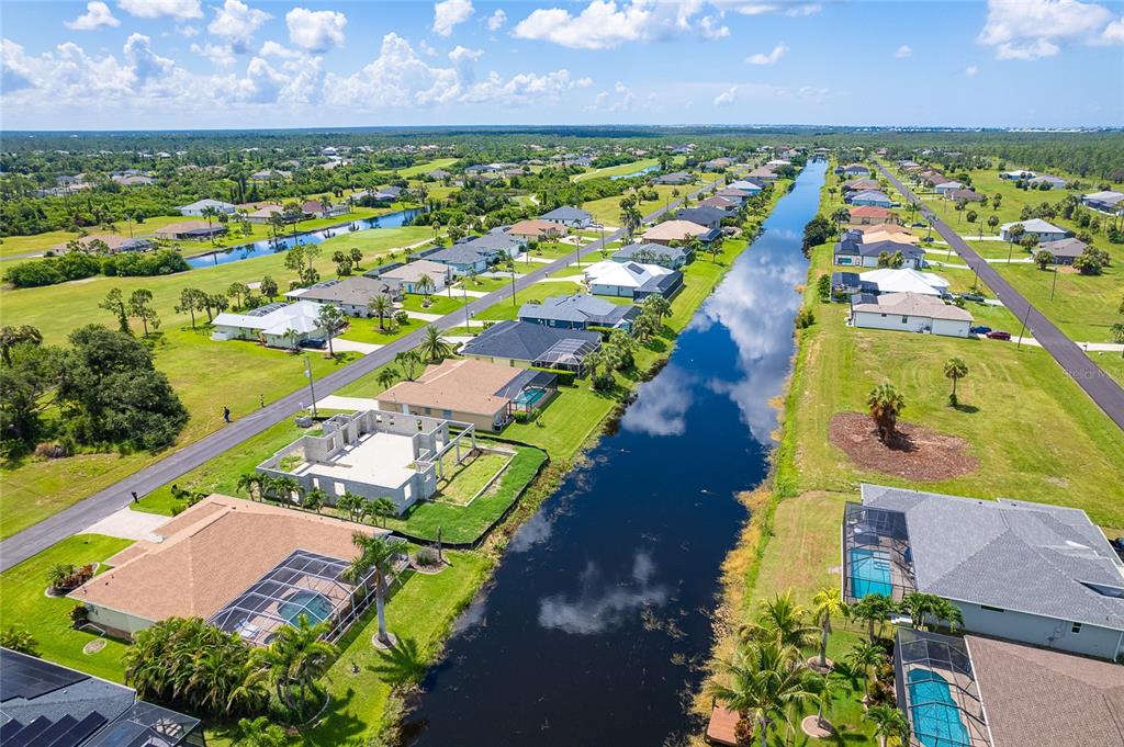 191 Tournament Road Rotonda West, FL 33947 - Photo 6 of 41 an aerial view of a house with a garden