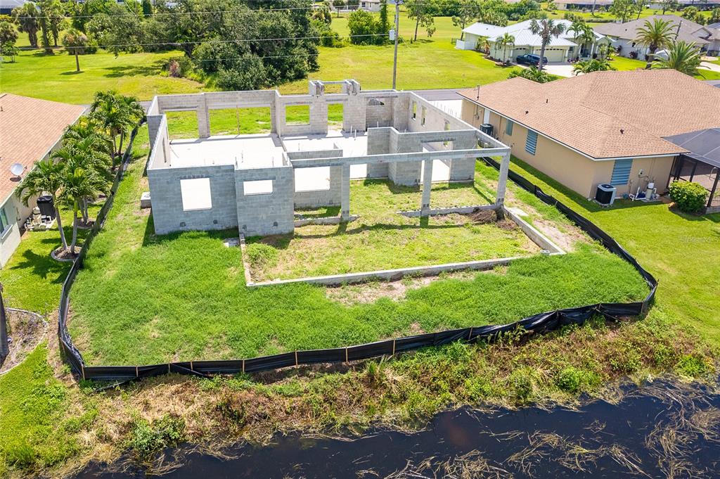 191 Tournament Road Rotonda West, FL 33947 - Photo 9 of 41 a view of a swimming pool with a patio and a yard