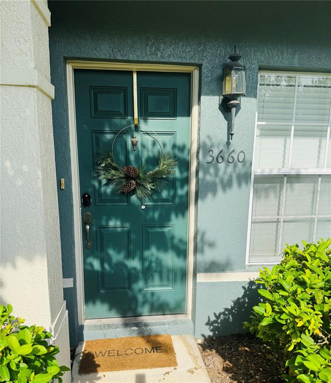 3660 Wilshire Way Road, Unit 260 Orlando, FL 32829 - Photo 2 of 25 a view of backyard door and porch