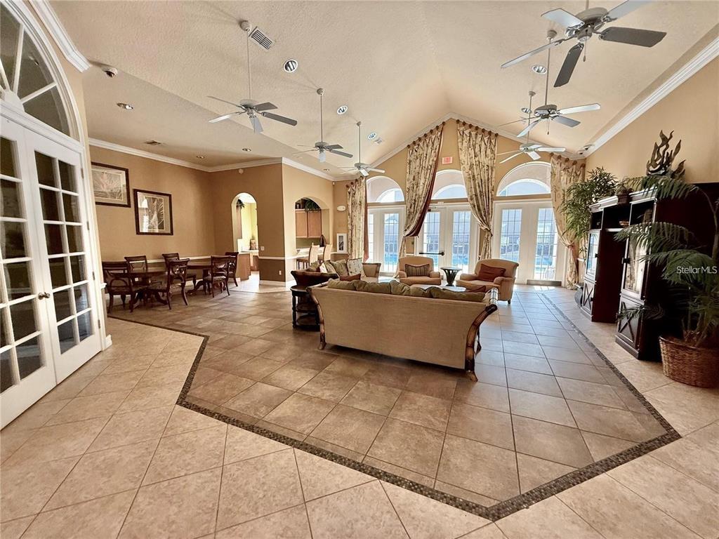 3660 Wilshire Way Road, Unit 260 Orlando, FL 32829 - Photo 24 of 25 a living room with couches a flat tv screen and kitchen view