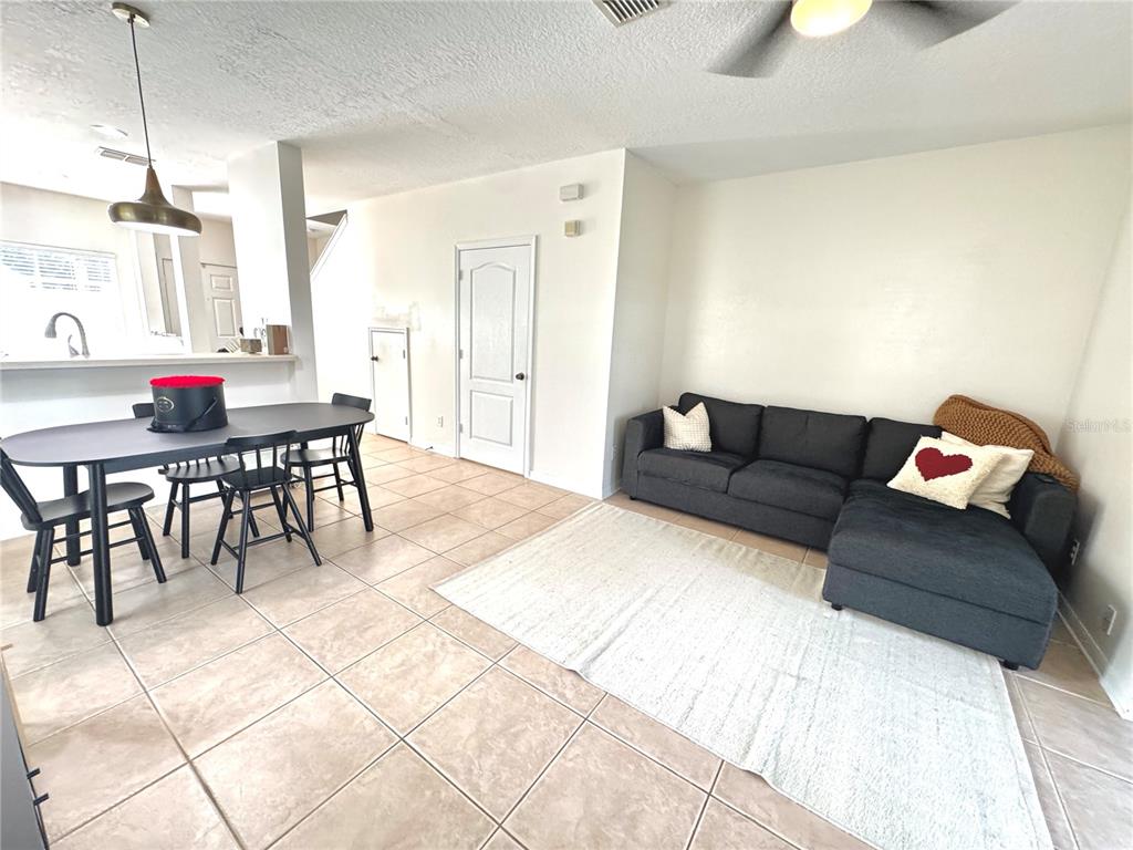 3660 Wilshire Way Road, Unit 260 Orlando, FL 32829 - Photo 8 of 25 a living room with furniture and a table