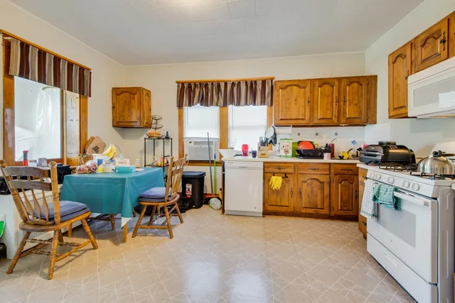 a kitchen with a sink cabinets and window