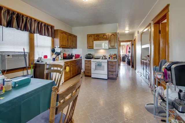 a view of a kitchen with appliances and cabinets