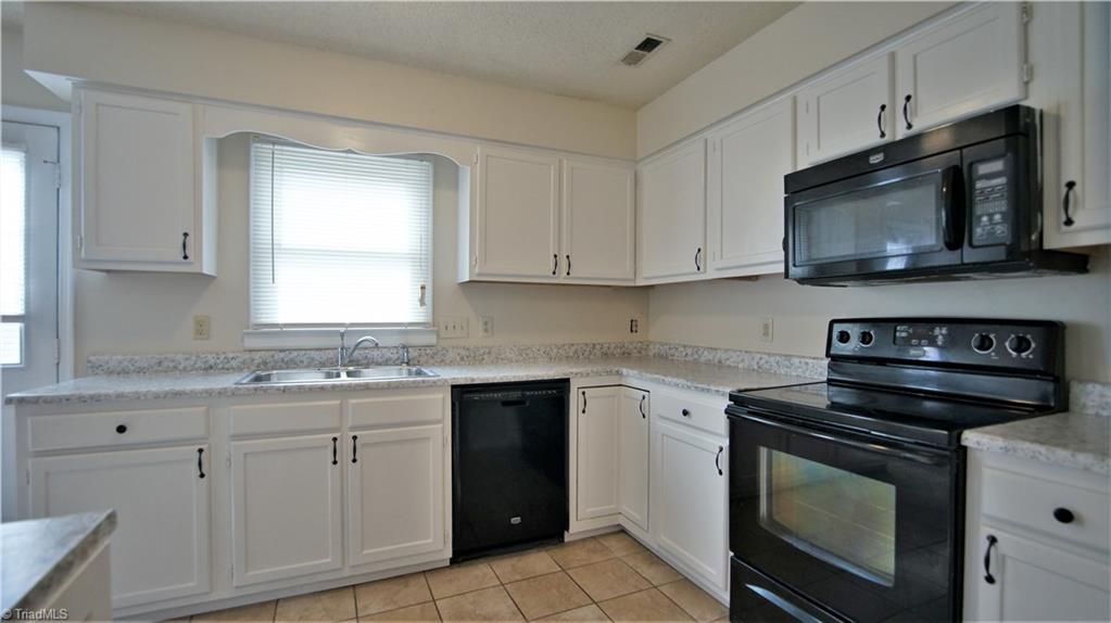 553 Covington Ridge Road Winston-Salem, NC 27107 - Photo 2 of 21 Kitchen with freshly painted cabinets