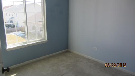 1663 Cesario Drive Hampshire, IL 60140 - Photo 7 of 14 an empty room with a window