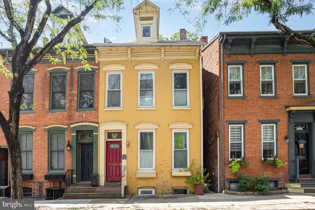 a front view of a multi story residential apartment building