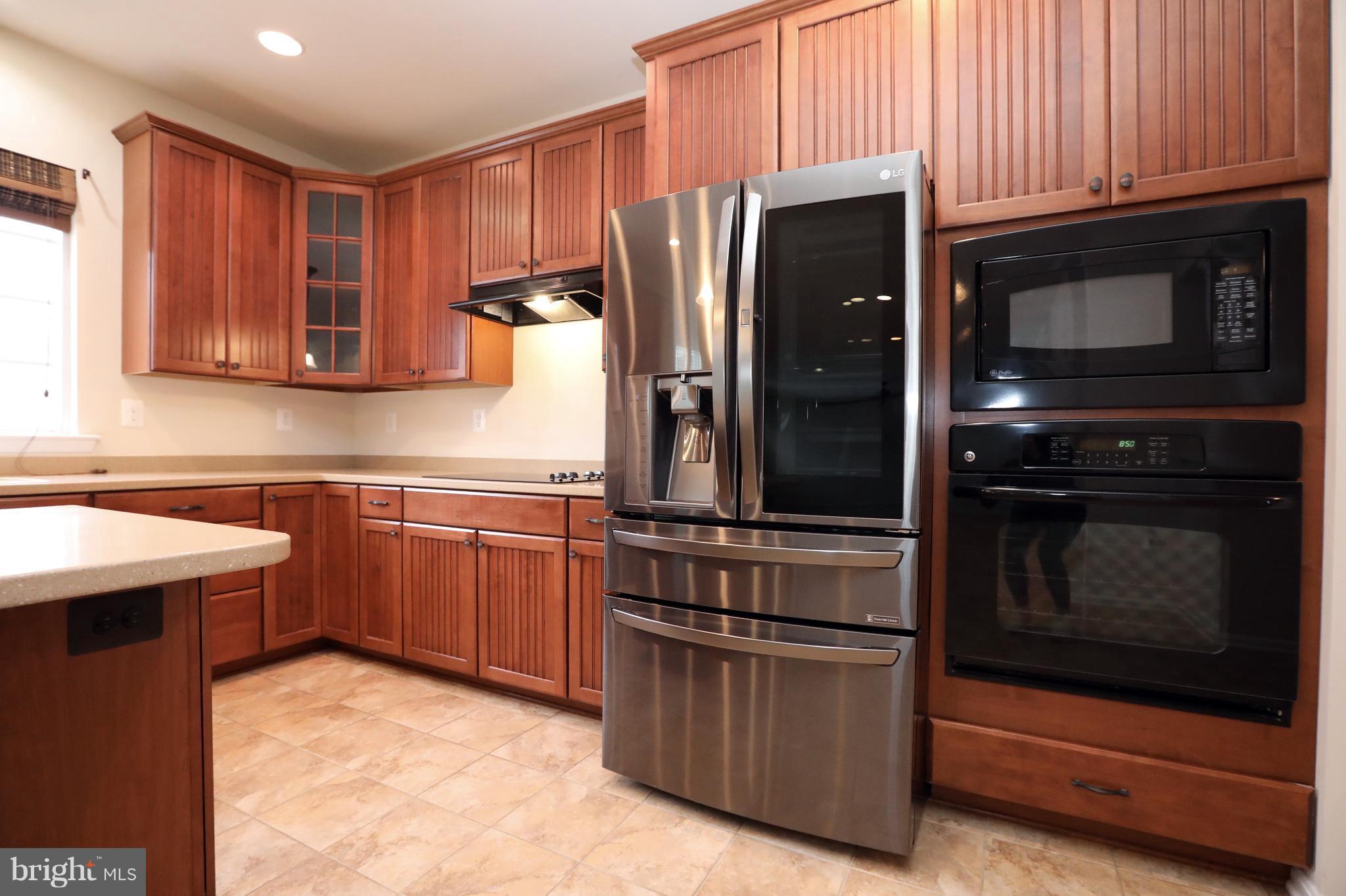7580 Knotting Hill Lane Port Tobacco, MD 20677 - Photo 12 of 30 a kitchen with a refrigerator stove and microwave