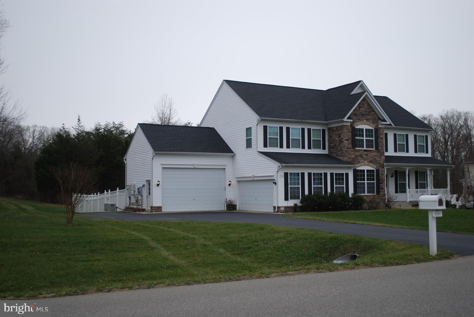 7580 Knotting Hill Lane Port Tobacco, MD 20677 - Photo 3 of 30 a view of a house with a big yard and large trees