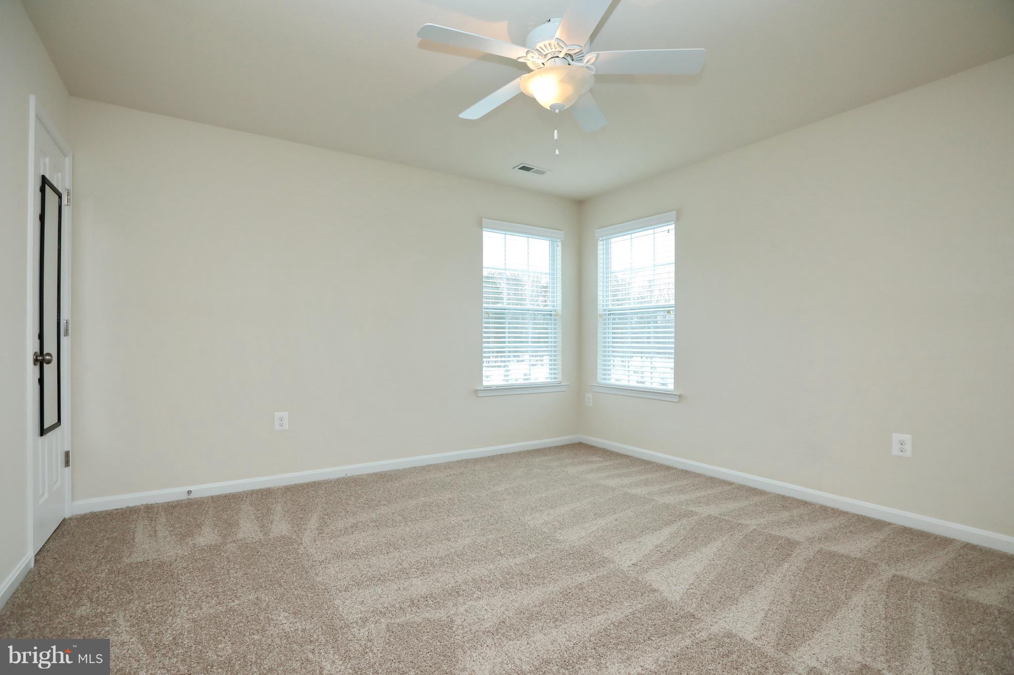 7580 Knotting Hill Lane Port Tobacco, MD 20677 - Photo 21 of 30 an empty room with a window and a fan