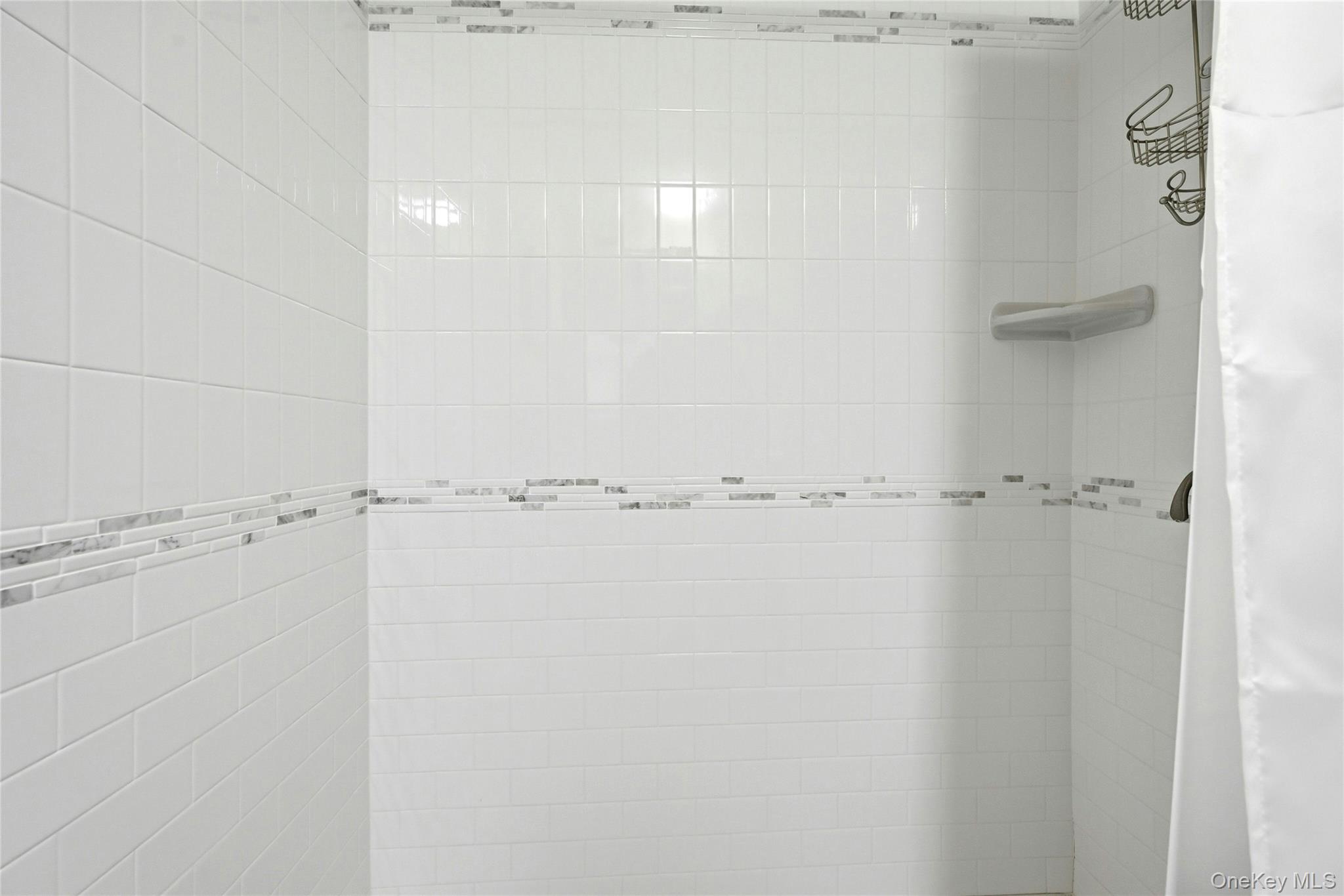 135 Oakwood Road Port Jefferson, NY 11777 - Photo 24 of 48 The Oversized Custom Shower In The Main Floor Full Bathroom With All Beautiful Tilework & Two Accent Borders.