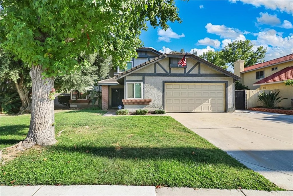 9006 Copley Lane Riverside, CA 92503 - Photo 1 of 1 a front view of a house with a yard