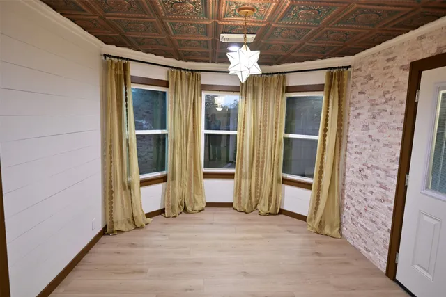 a view of a hallway with wooden shelves