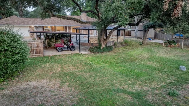 a view of a house with a yard and sitting area