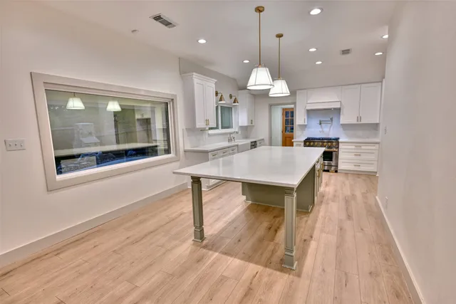 a open kitchen with a table and chairs