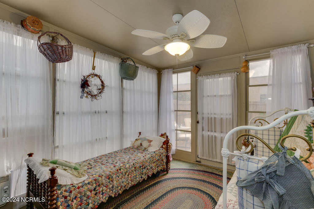 112 Old Oak Road Elizabeth City, NC 27909 - Photo 13 of 18 State-of-the-art telescoping windows, it can be transformed into a screened porch for breezy days, while the air conditioner and heater ensure comfort in any season