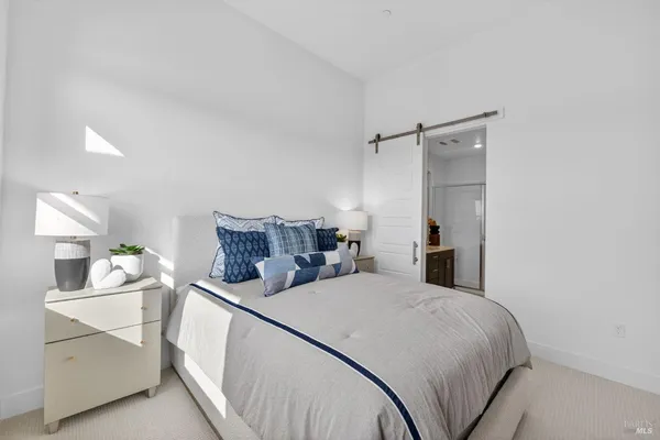 a bedroom with a bed and a cabinets