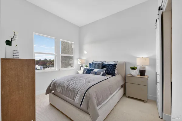 a bedroom with a bed and a cabinets