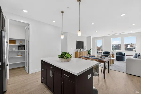 a kitchen with a counter top appliances and cabinets